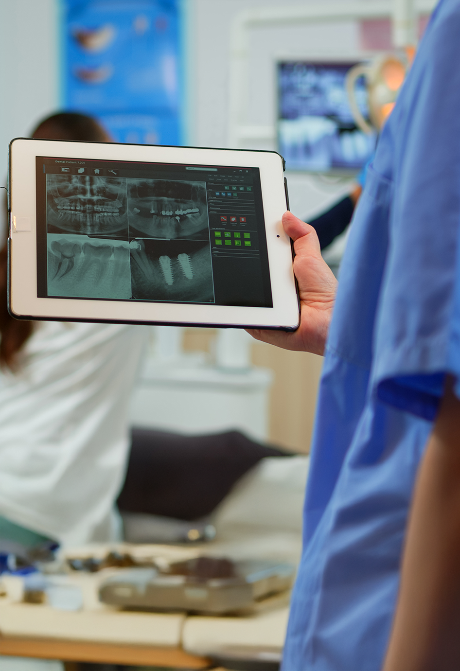 Doctor reviewing X-ray on a tablet before root canal