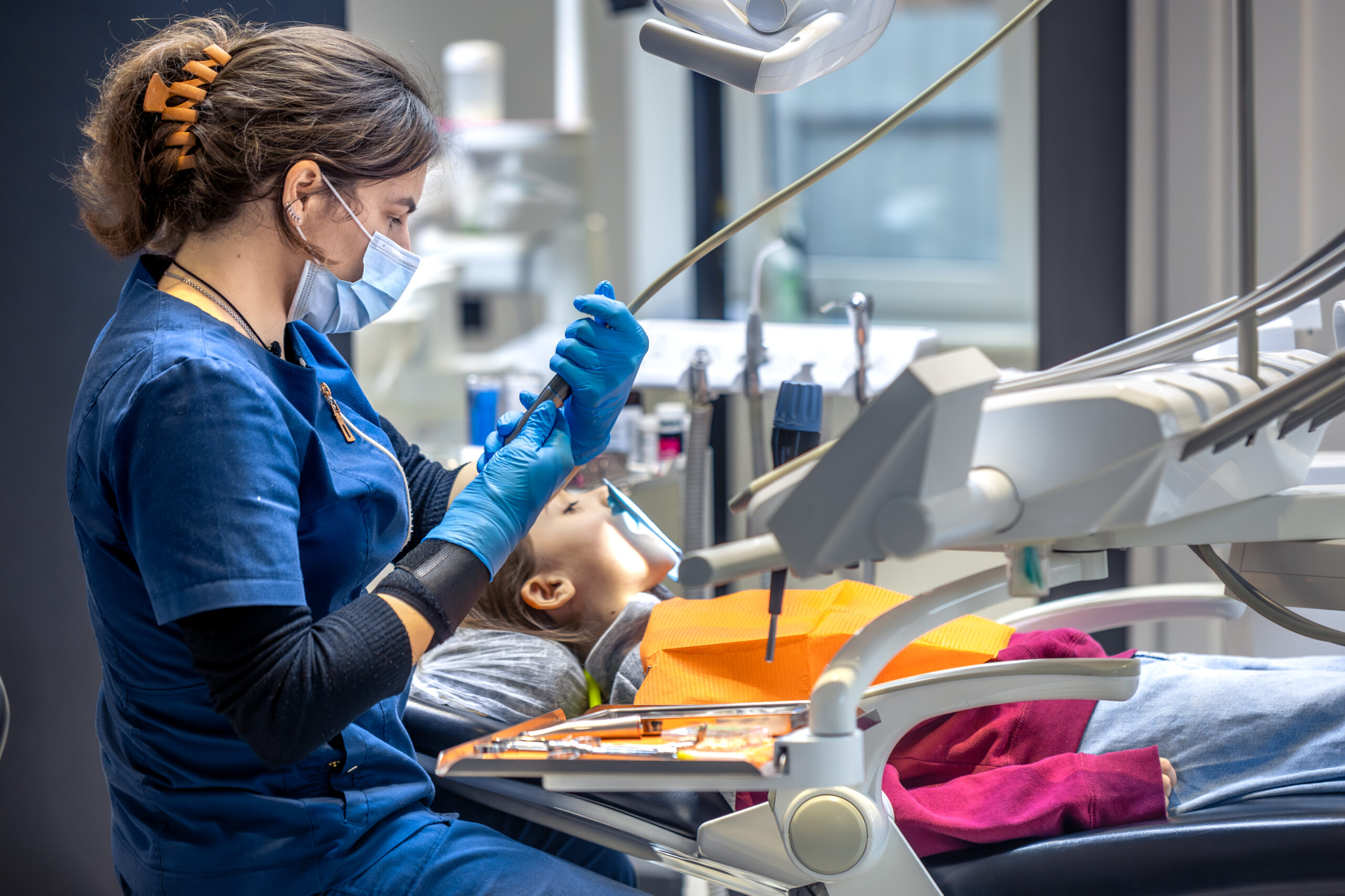 Dentist preparing tooth for a crown